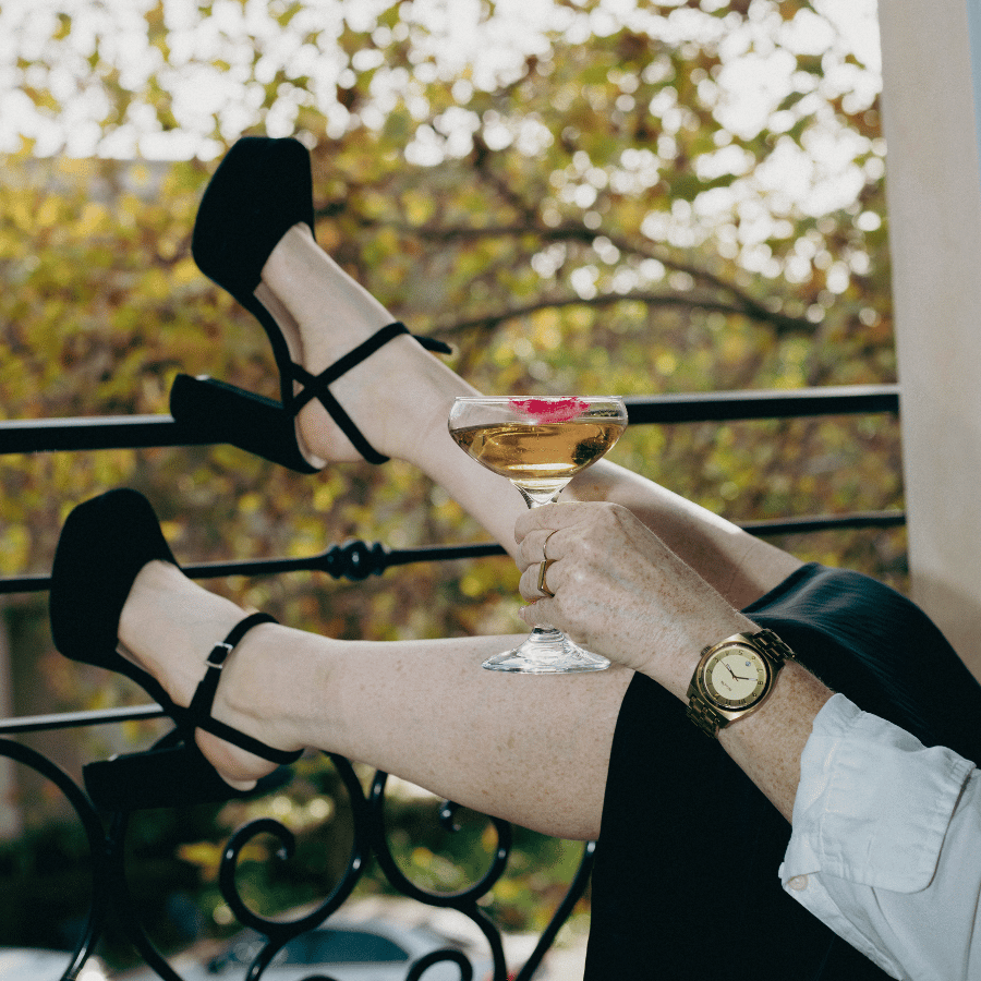 a person holding a glass of wine